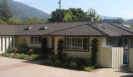 Light brown colored home with brown decra steel shake roofing